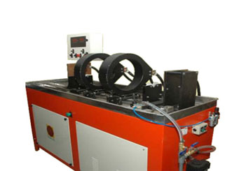 Industrial tempering furnace for metal structural refinement after induction heating.